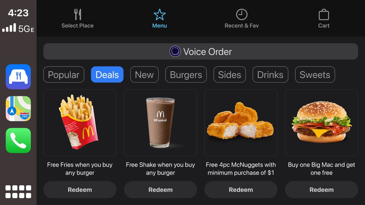 McDonald's menu on the Deals tab, with a Voice Order button and a Redeem button under each deal